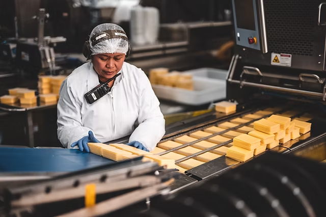 Dairyworks employee using SoterCoach wearable in production facility