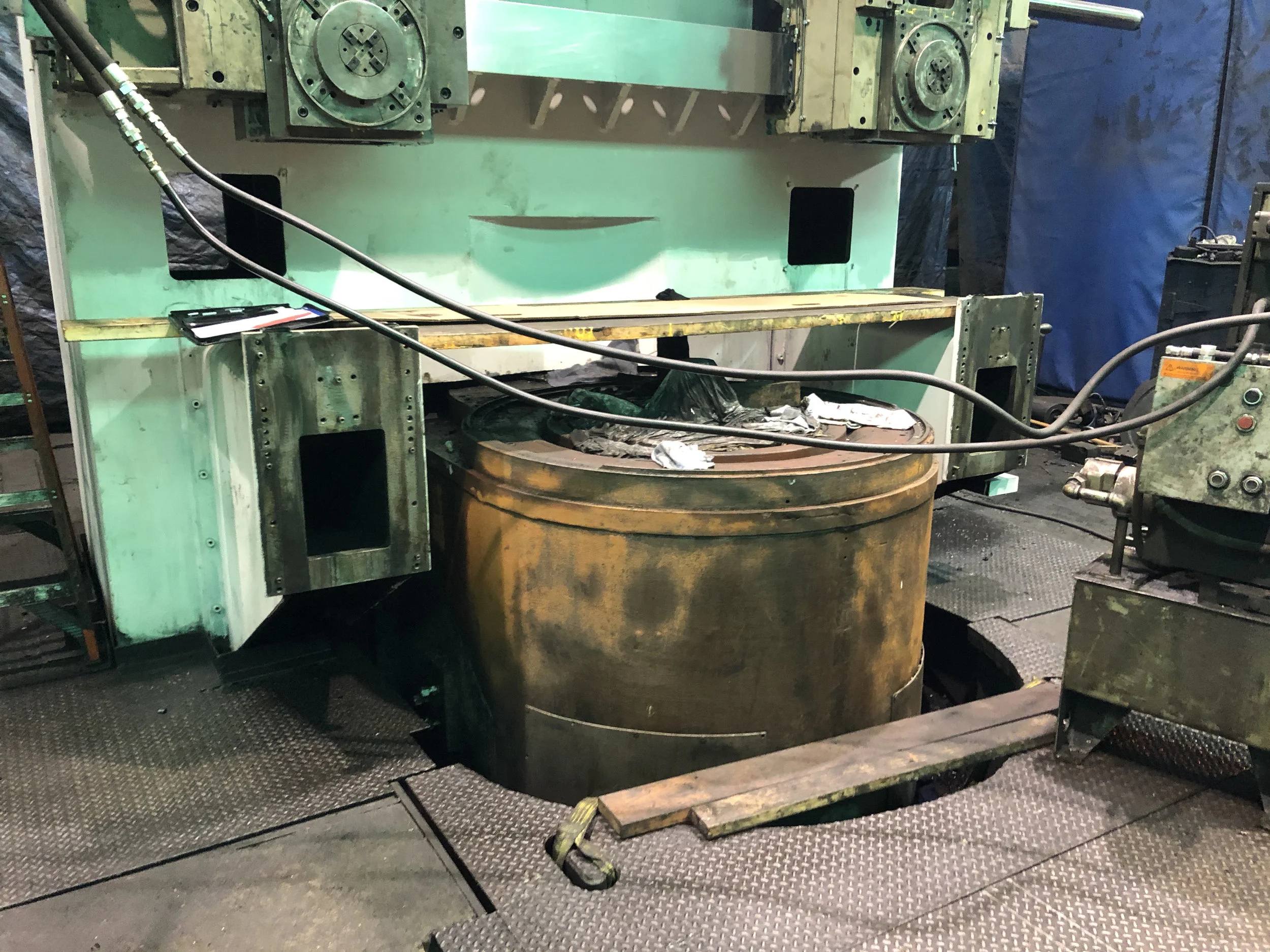 Unguarded industrial press with exposed point of operation and rotating parts